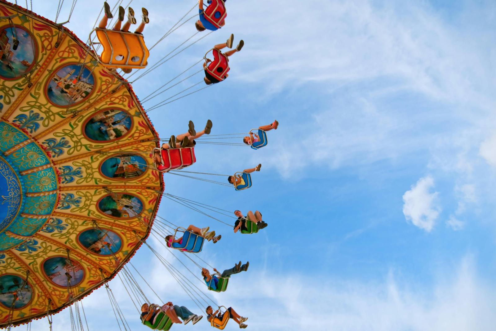 People Riding Carousel in amusement Park
